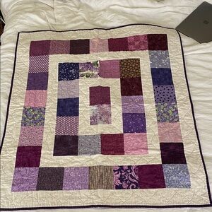 Patchwork Quilt with Purple and Cream Tones
